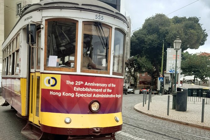 1-hour private eco tuk-tuk tour for up to 6 people through Lisbon - Alfama Streets, Fado Roots, and Trying Ginginha