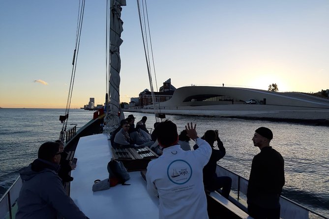 2-Hour Lisbon Traditional Boats Sunset Cruise with White Wine - Padrão dos Descobrimentos, plus a quick reality check on the scenery