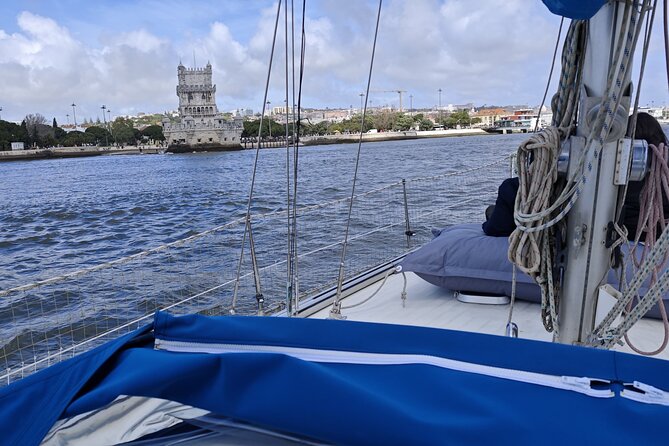 2 Hour Sailboat Sunset Tour by RiverMountain Lisbon - Turning south across the river for factories and graffiti