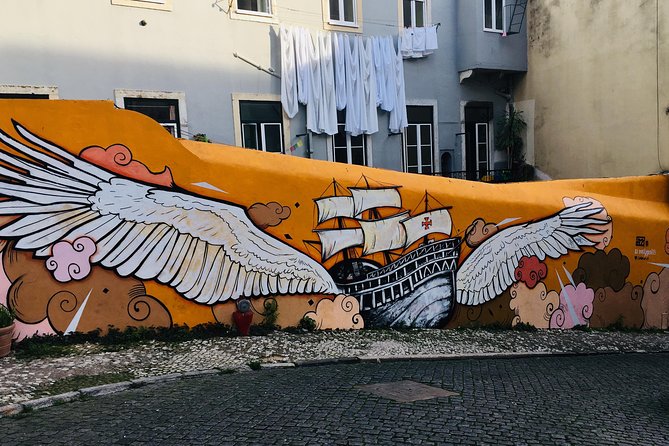 3-Hour Guided Street Art Walking Tour of Lisbon - Stop 1: Bairro Alto street art tied to nightlife traditions