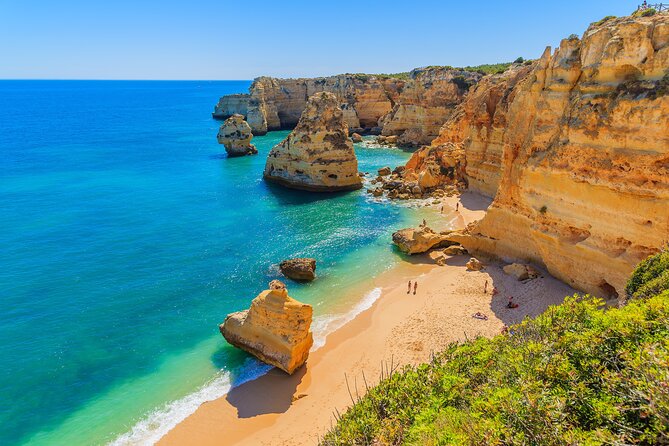 Algarve Private Tour from Lisbon with Boat Ride - Carvoeiro fishing village: cliffs, small beaches, and quick seaside wandering