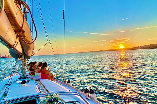Amazing Tour on Sailing Boat - The Sunset Moment: Catch the 25th of April Bridge in Golden Light