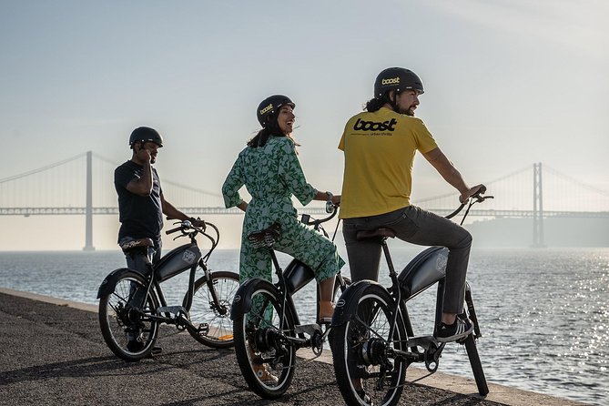Belém E-Bike Guided Tour Explore Lisbon by the river - Between stops: dock areas and the 25th of April Bridge moment