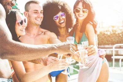 Boat Party to the Beach with Swimming Stops, DJ and Open Bar