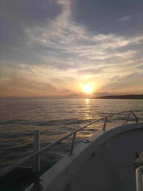Cascais: Sunset Boat Trip with Welcome Drinks - Costa da Guia cliffs and the open-sea sunset moment