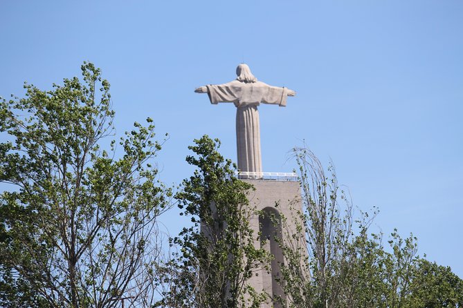 Christ the King - Lisbon - 3 Hour Electric Bike Tour - Ribeira das Naus and the Tagus ferry on an orange cacilheiro