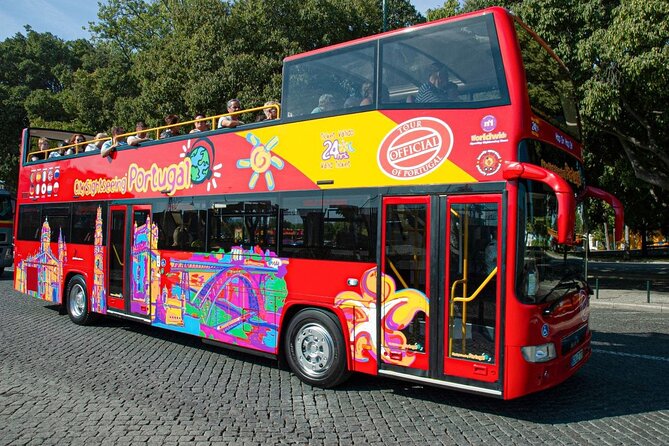 City Sightseeing Lisbon Hop-On Hop-Off Bus Tour & Bookable Extras - Azulejo culture and the Poseidon mural stop that feels oddly modern