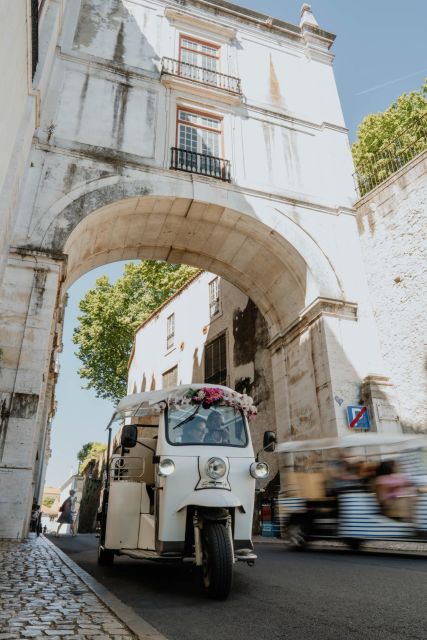 Discover Lisbon 4h Tuk Tuk - Alfama, Praça do Comércio, and the Pink Street stop