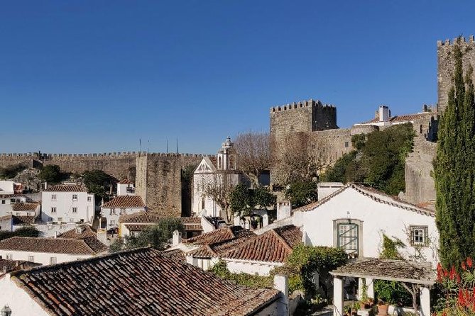 Fátima Batalha Nazaré and Óbidos Full Day Tour from Lisbon - Óbidos: medieval walls, narrow lanes, and a chocolate cup of ginjinha