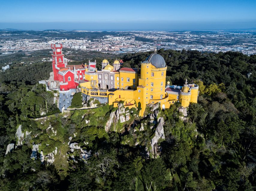 From Lisbon: Half-Day Private Sintra Cascais Tour - Pena Palace: whimsical architecture and the royal-style viewpoint