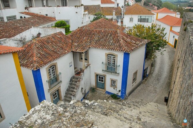 From Lisbon : Óbidos & Nazaré Giant Waves, Ginja & Small Group - Stop 1: Óbidos Village Walls, Colorful Streets, and Ginjinha