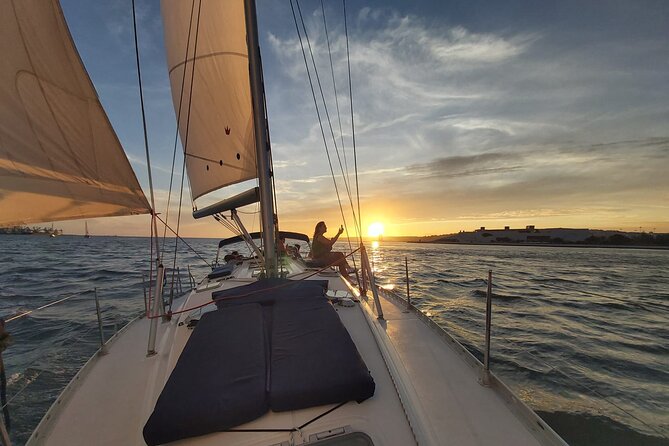 Golden Hour Boat Tour - Sailing by the Monuments with Wine - Starting at Doca de Santo Amaro, where the river trip begins
