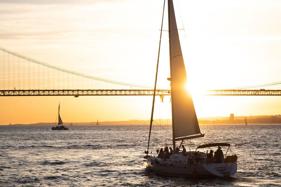 Lisbon: Alfama Charms, Tapas, Wine and Sunset Boat Cruise - The sunset sail on the Tagus: city lights from the water