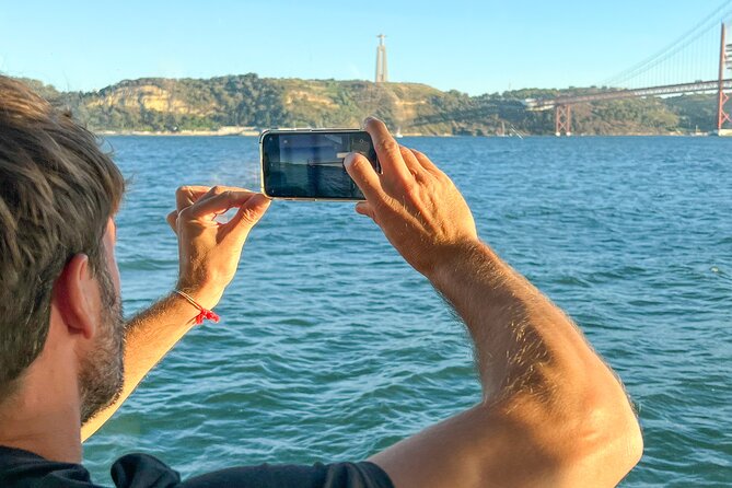 Lisbon Boat ride on Tagus river - Under The 25 de Abril Bridge: A Moving Photo Moment