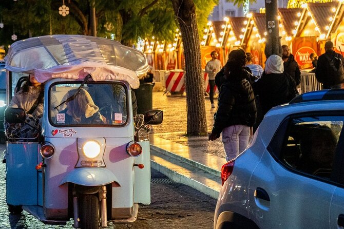 Lisbon Christmas Lights Tuk-Tuk Tour with Local Guide - Camoes Square: A Palace-Style Holiday Installation