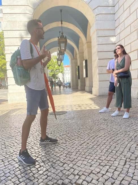 Lisbon: City Highlights Guided Walking Tour - Getting Oriented at Praça do Comércio, the Orange Umbrella Start