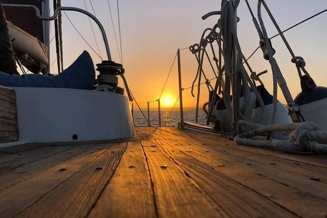 Lisbon: Daylight or Sunset on a Vintage Sailboat - Christ the King and the 25 de Abril Bridge: Lisbon’s Big Symbols, Sized Correctly