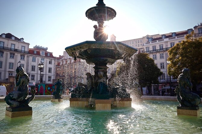 Lisbon Food Tour with 10+ Tastings of Local Delicacies & Wines - Landmark stops: Santa Justa lift, Pedro IV Square, and a castle area