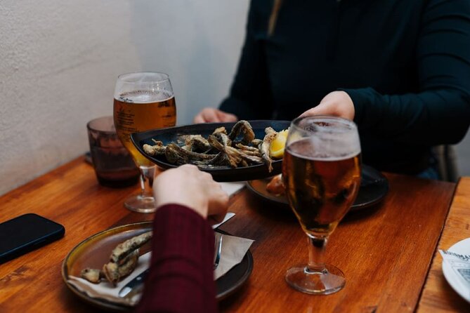 Lisbon Food Tour with Portuguese Wine: Taste the Best of Portugal - Rua dos Fanqueiros: chouriço, bacalhau à Brás, and local wine pairing