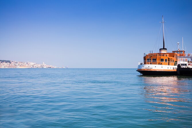 Lisbon Hidden Gems Walk: Traditions, Lunch and Ferry ride - Lunch by the river: seafood rice, green wine, and the real value
