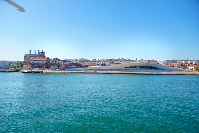 Lisbon River Boat Sightseeing Tour with a Drink - 25 de Abril Bridge: Golden Gate color, Bay Bridge design, Lisbon pace
