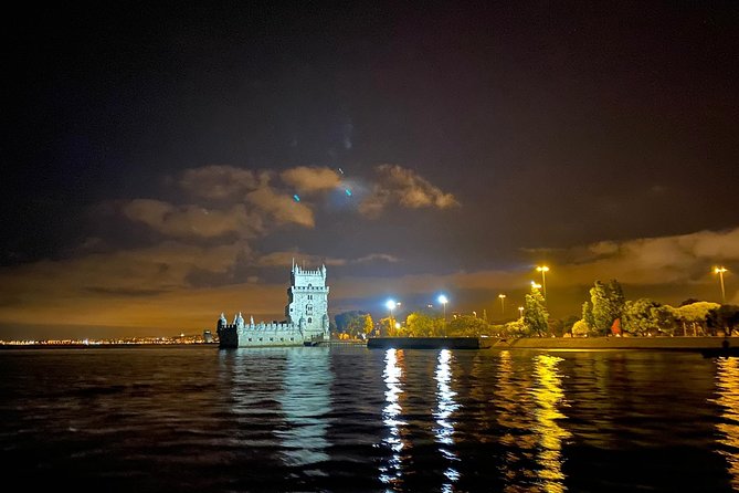 Lisbon Sailing Tour by Night - Jerónimos Monastery and the 25 de Abril Bridge: big architecture, wide night sky
