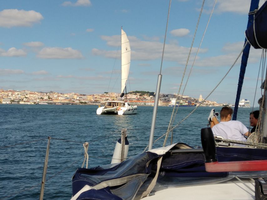 Lisbon: Sailing Tour with Wine and Snacks - Under the 25 de Abril Bridge: The Moment the Boat Feels Like a Boat