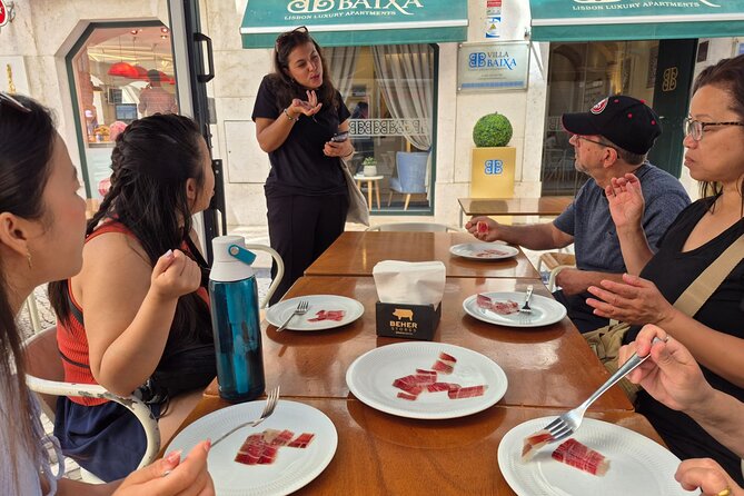Lisbon Small-Group Food Tour: Eat & Drink Like a Local - The main course: green wine, cheese, then seafood rice and bacalhau à Brás