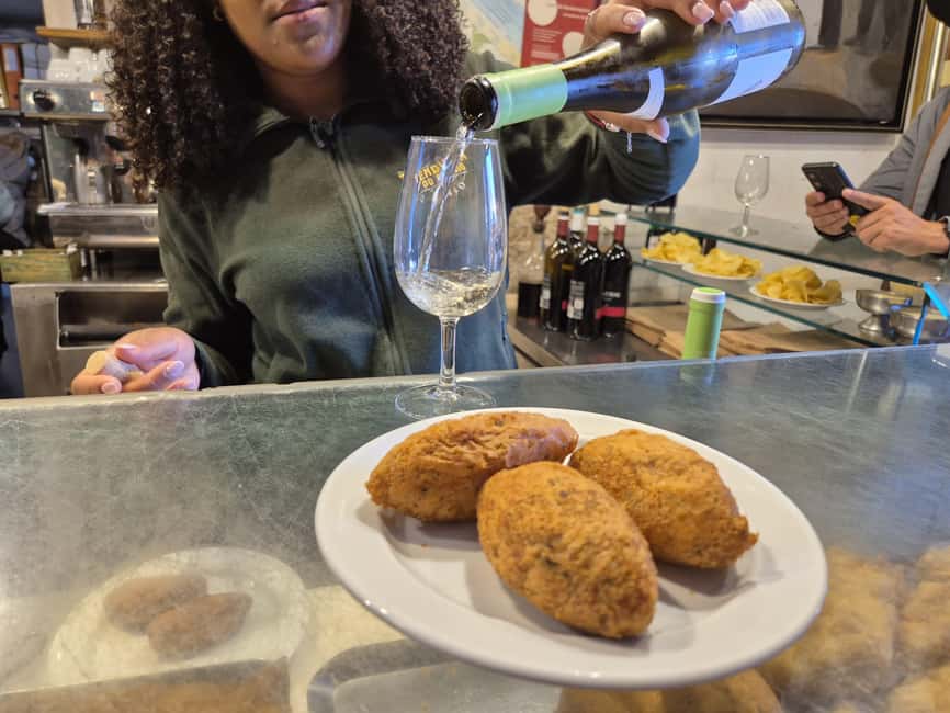 Lisbon Small-Group Food & Wine Tour Eat & Drink like a Local - Green wine, cheese, then the seafood rice that Lisbon is built on
