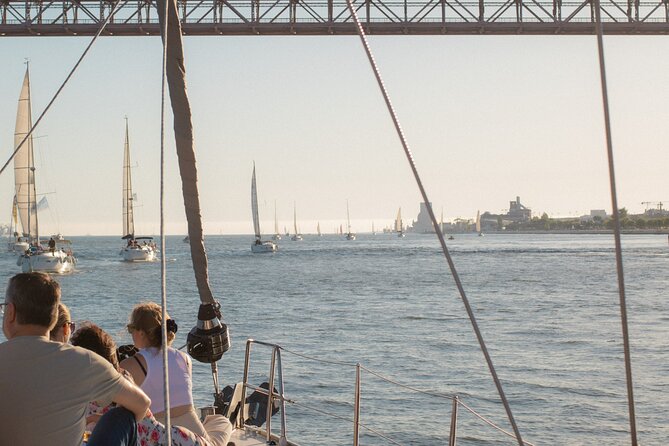Lisbon Sunset Boat Cruise Tour With Drinks Included - Crew style and commentary, what it feels like on board