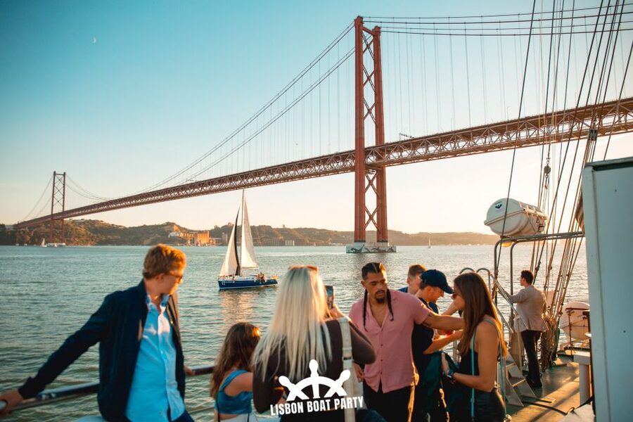 Lisbon: Sunset Boat Party with 2 Drinks and Free Club Entry - Christ the King pass-by: spotting Lisbon from above