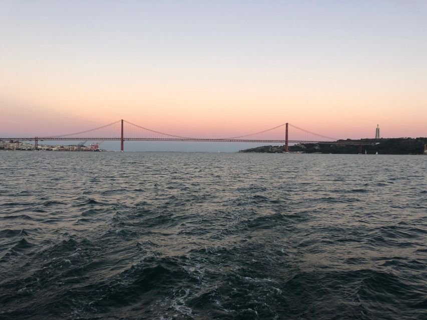 Lisbon: Sunset Boat Tour with a drink - The 25 April Bridge: A Photo Stop Without the Crowd Hassle