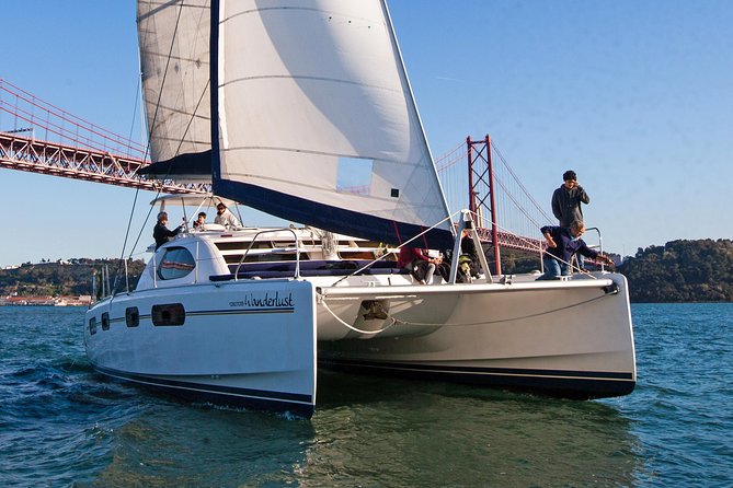 Lisbon: Sunset Cruise With Drinks on Spacious Yacht - Drinks, blankets, and what comfort looks like on a winter sunset