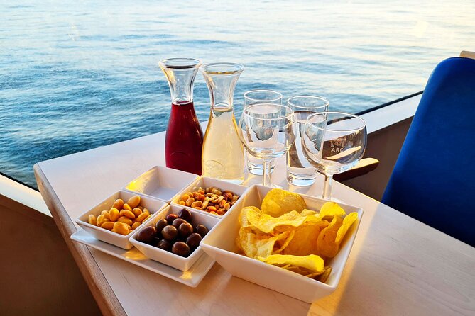 Lisbon Sunset cruise with Welcome Drink and Snack included - Ponte 25 de Abril: under the bridge, with trains below cars