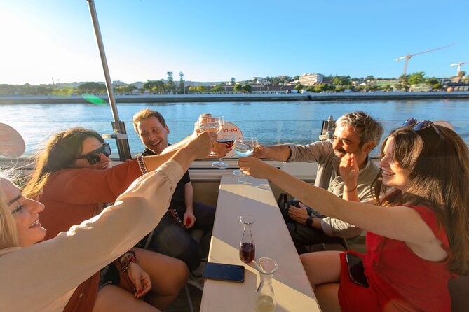 Lisbon Sunset cruise with Welcome Drink and Snack included - MAAT’s reflective tiles and how the modern building plays with light