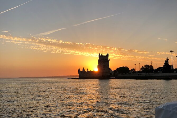 Lisbon Sunset Sailing Tour History & Local Wine — Small Group - Christ the King and Praça do Comércio: the classic Lisbon ends meet river reality