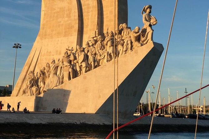 Lisbon: Sunset Sailing with Portuguese Wine and History - 25 de Abril Bridge and the Electricity Museum pass-by: modern icons, told simply