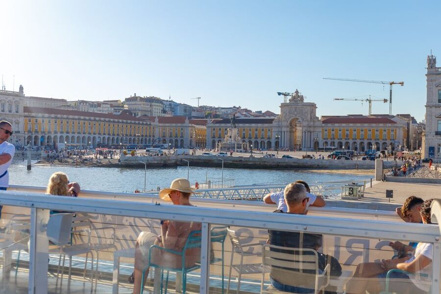 Lisbon: Tagus River Cruise with Welcome Drink - From Commerce Square Toward Alfama: Colorful Buildings, Easy Photos