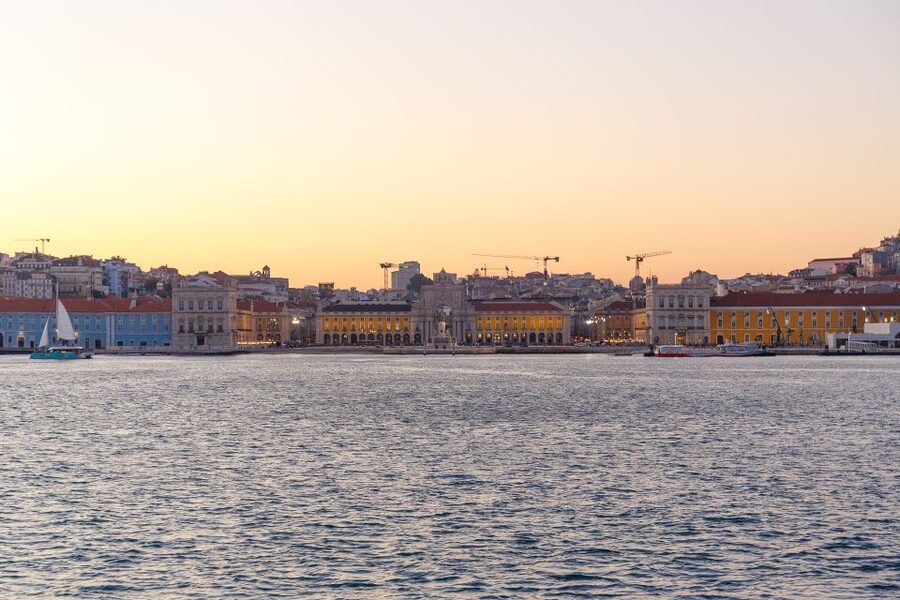 Lisbon: Tagus River Sunset Tour with Snacks and Drink - Commerce Square and Alfama from the river: the “color and curve” moment