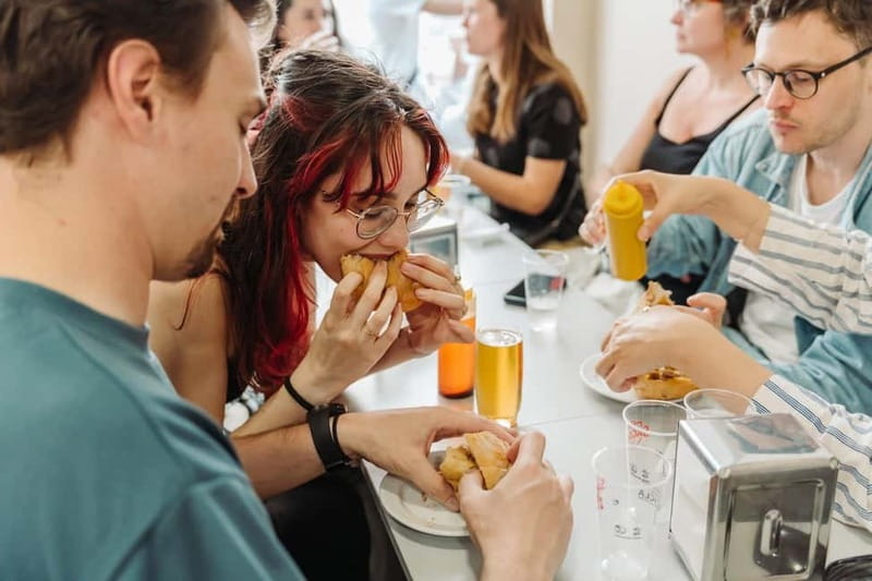Lisbon: Tastes and Traditions Guided Food Tour - Tasca lunch: salt cod with alheira sausage, plus the comfort of a family table