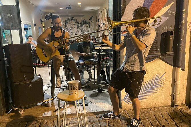 Multicultural Lisbon Walk: Food Tastings, Stories & Live Music - Castle hill districts: Alfama and Mouraria on foot, with street art and live jam energy