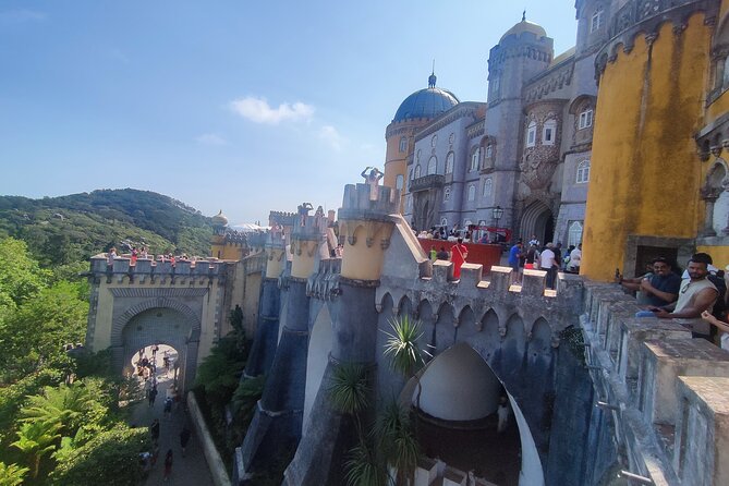 Sintra, Pena, Regaleira , and Cascais Guided Day Tour from Lisbon - Pena Palace and Park: crowds, uphill stairs, and smart timing