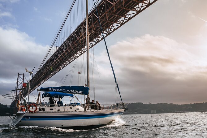 Sunset Sailboat Tejo River Tour 2h - Outbound sights: Torre de Belém, Praça do Comércio, and the Discoveries area